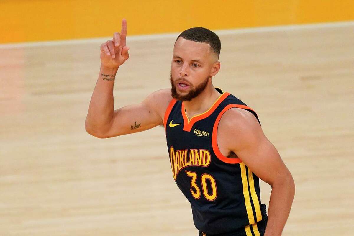 Golden State Warriors guard Stephen Curry gestures after scoring during the second half of an NBA basketball Western Conference Play-In game against the Los Angeles Lakers Wednesday, May 19, 2021, in Los Angeles. The Lakers won 103-100. (AP Photo/Mark J. Terrill)