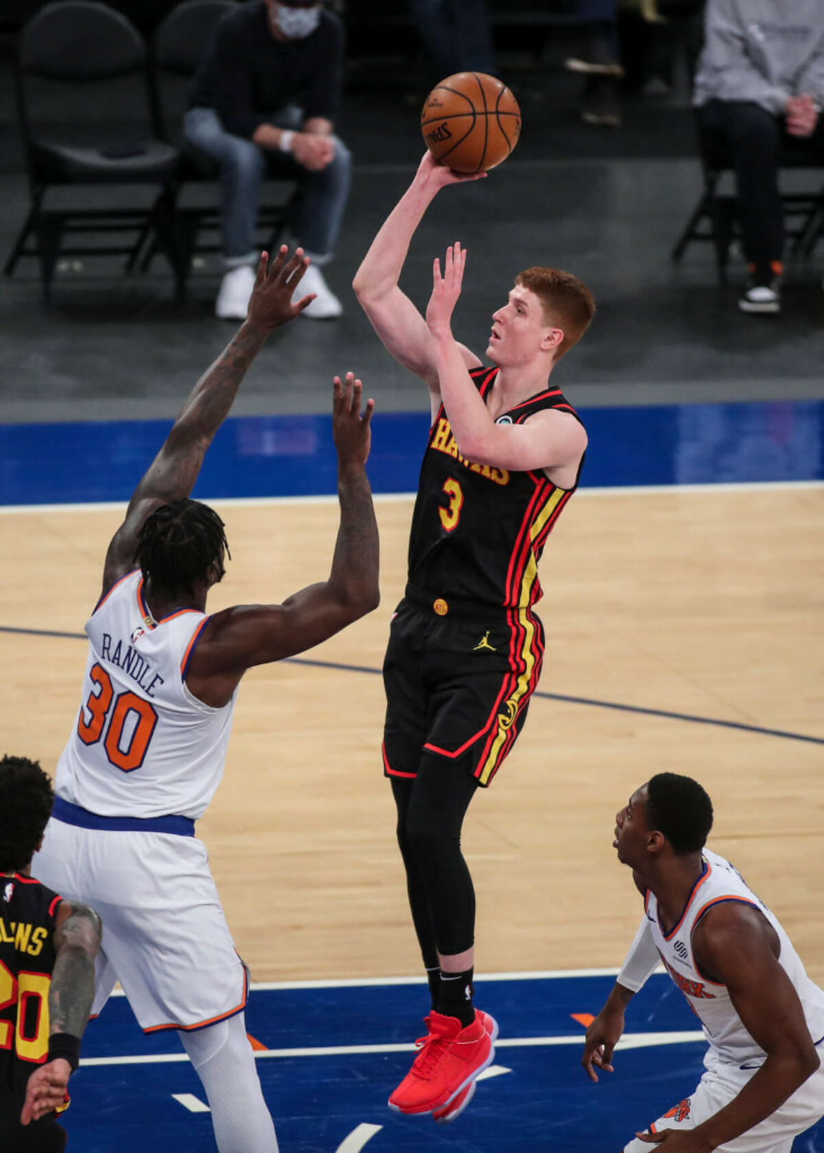 Atlanta Hawks guard Kevin Huerter, a Shenendehowa graduate, shoots over New York Knicks forward Julius Randle earlier this season. They'll meet in Game 1 of an NBA playoffs first-round series on May 23, 2021 at Madison Square Garden. (Associated Press)
