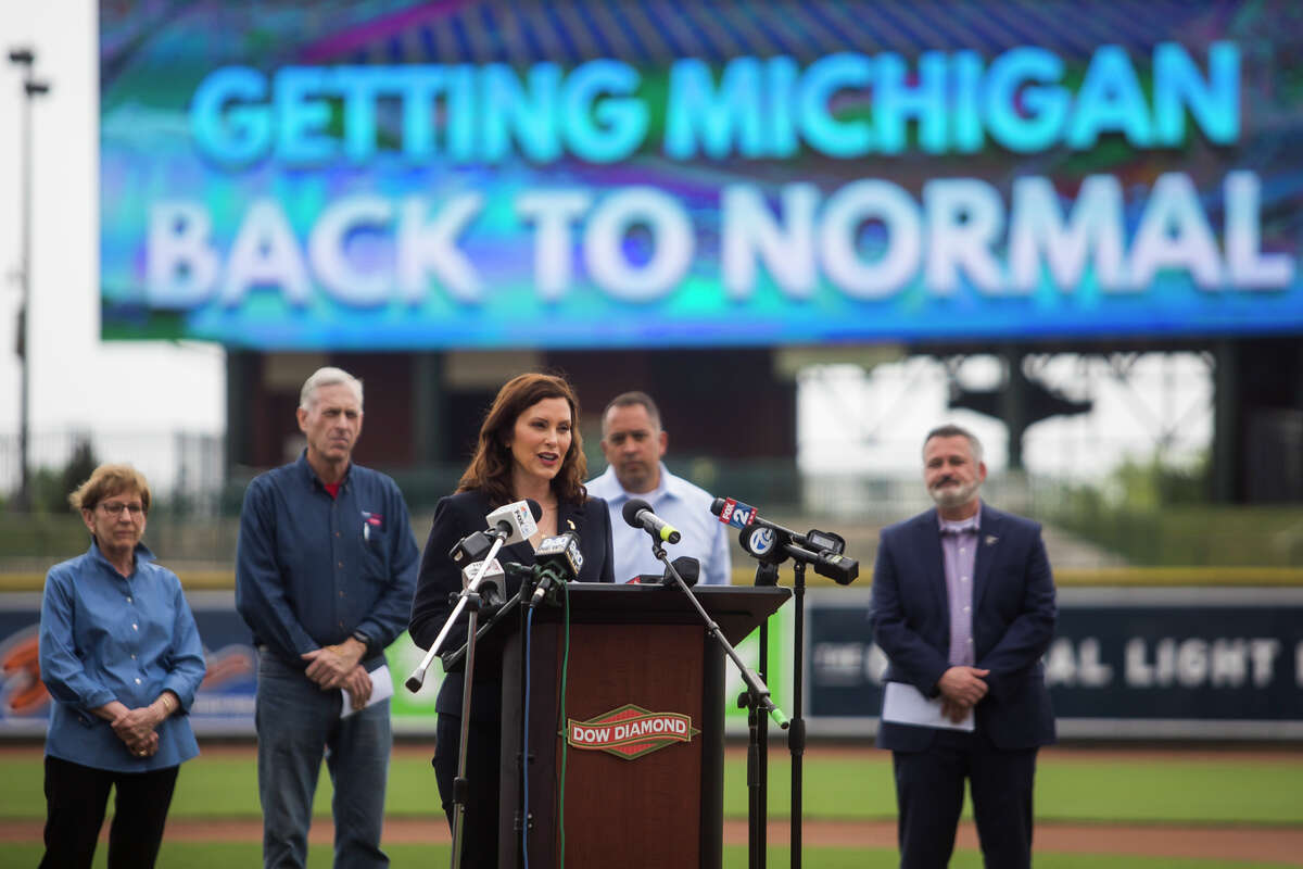 Gov. Gretchen Whitmer speaks during a press conference Thursday, May 20, 2021 at Dow Diamond in Midland, where she announced all outdoor capacity limits will be lifted across the state after June 1. Whitmer was joined by Lt. Gov. Garlin Gilchrist, Midland Mayor Maureen Donker, Dow CEO Jim Fitterling, Great Lakes Bay Regional Alliance President Matthew Felan and Great Lakes Loons President Chris Mundhenk. (Katy Kildee/kkildee@mdn.net)