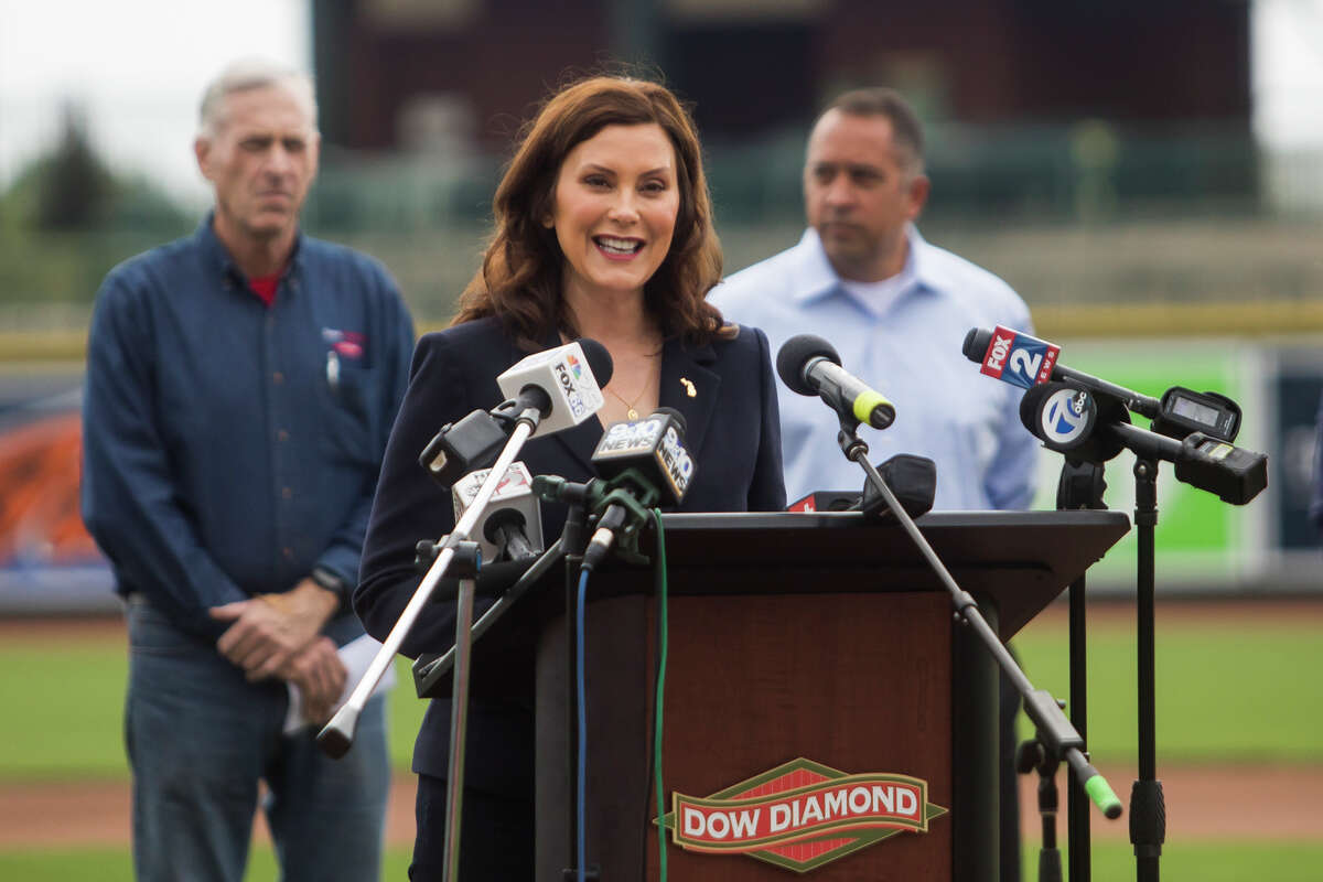 FILE — Gov. Gretchen Whitmer speaks during a press conference Thursday, May 20, 2021 at Dow Diamond in Midland, where she announced all outdoor capacity limits will be lifted across the state after June 1.