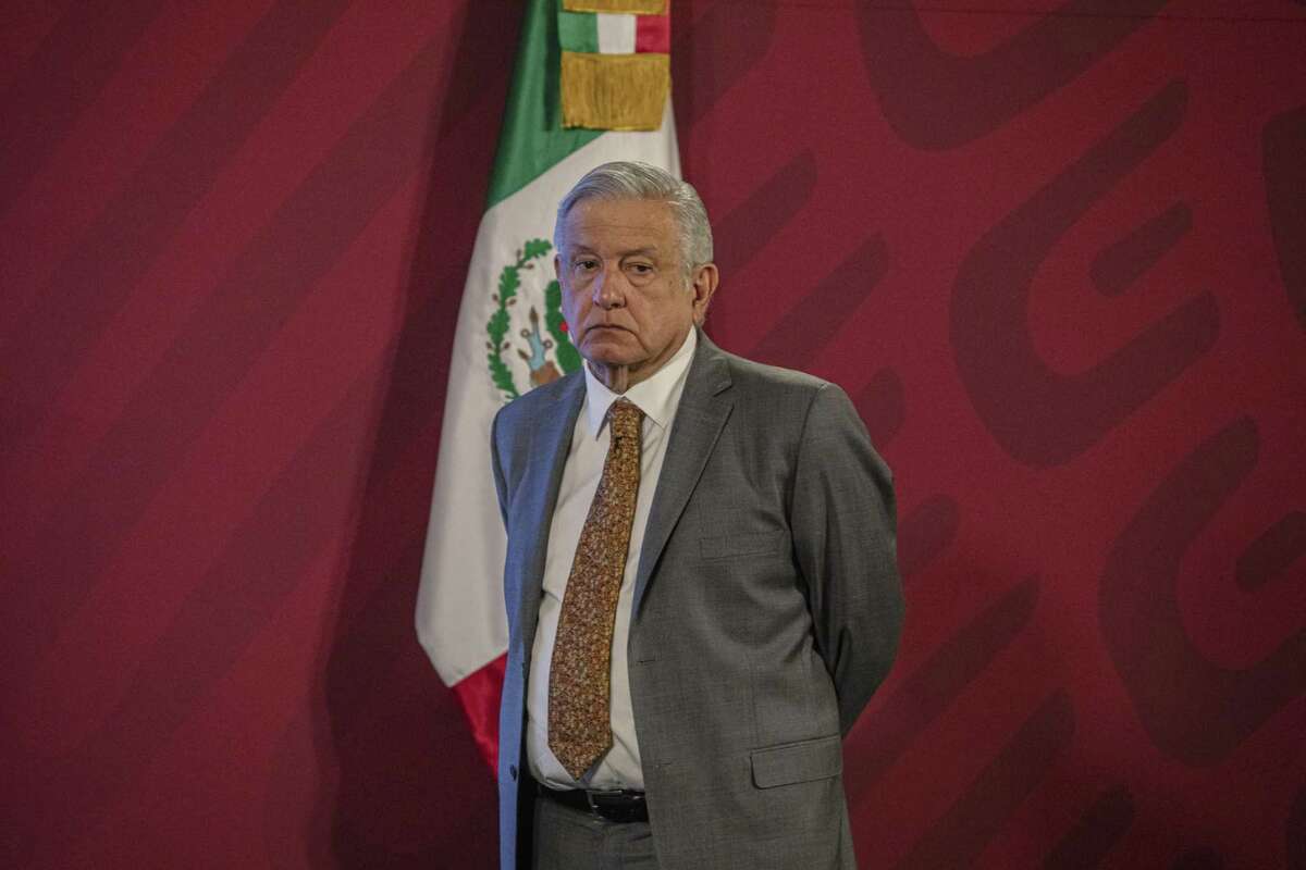 Andres Manuel Lopez Obrador, Mexico's president, stands during a news conference at the National Palace in Mexico City, last year. AMLO’s morning press conference is a gladiator’s arena in which the reputation of a person in the public sphere, a company, organization, or government agency can be mauled by derogatory claims and insinuations, the author writes.