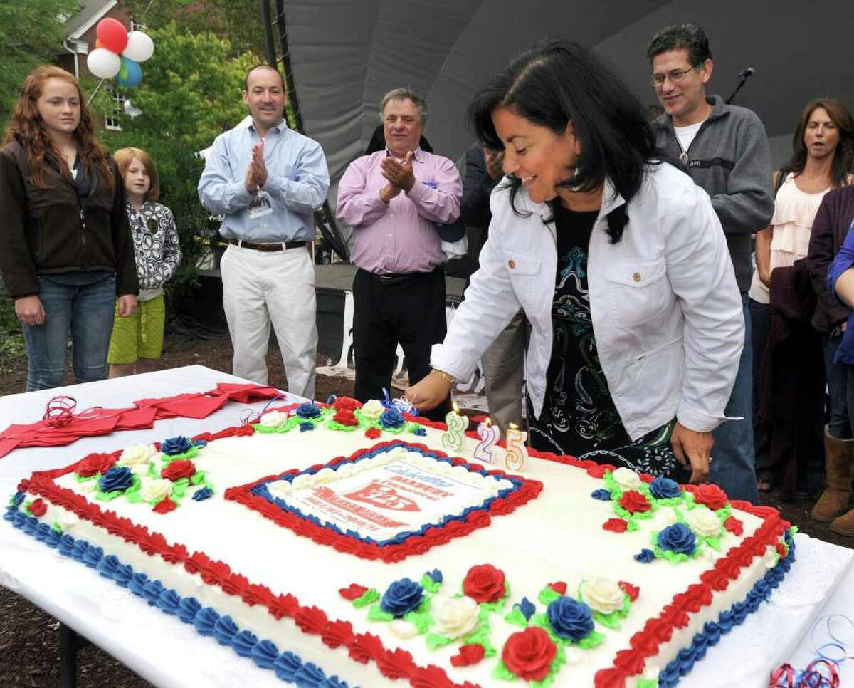 Danbury's First Lady Phyllis Boughton cuts the first slice into the cities birthday cake. Danbury is celebrating it's 325th birthday. Photo taken Sunday, Sept. 12, 2010.