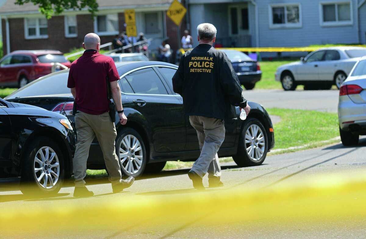 Norwalk police investigate a shooting at Colonial Village Thursday, May 20, 2021, in Norwalk, Conn.
