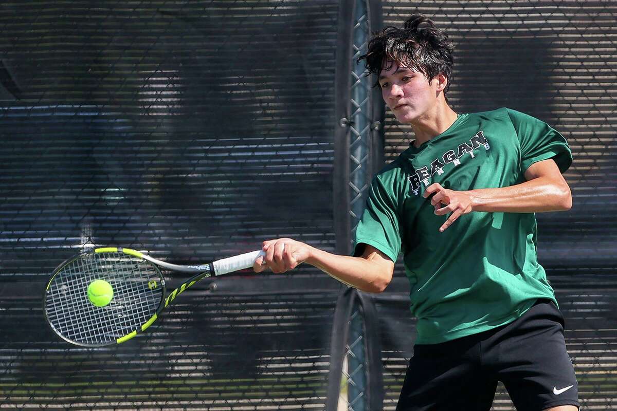 Reagan's Ryan Totorica returns a shot while playing in 6A boys singles against Conroe The Woodlands' Aidan Lee during the first day of the UIL state tennis tournament at the Northside Tennis Center on Thursday, May 20, 2021. Totorica beat Lee 6-1, 4-6, 7-6 (7).