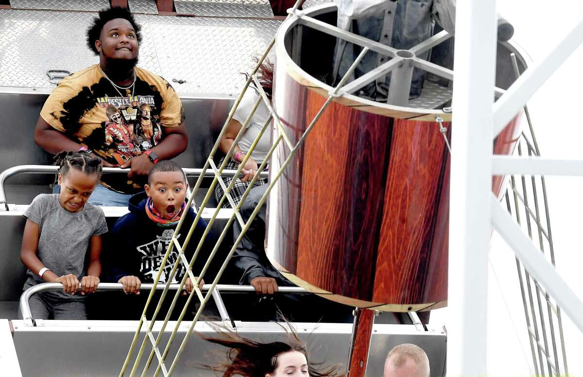 Families and friends enjoy the thrills of the carnival rides on the opening night of the YMBL South Texas State Fair Thursday. Photo made Thursday, May 20, 2021 Kim Brent/The Enterprise