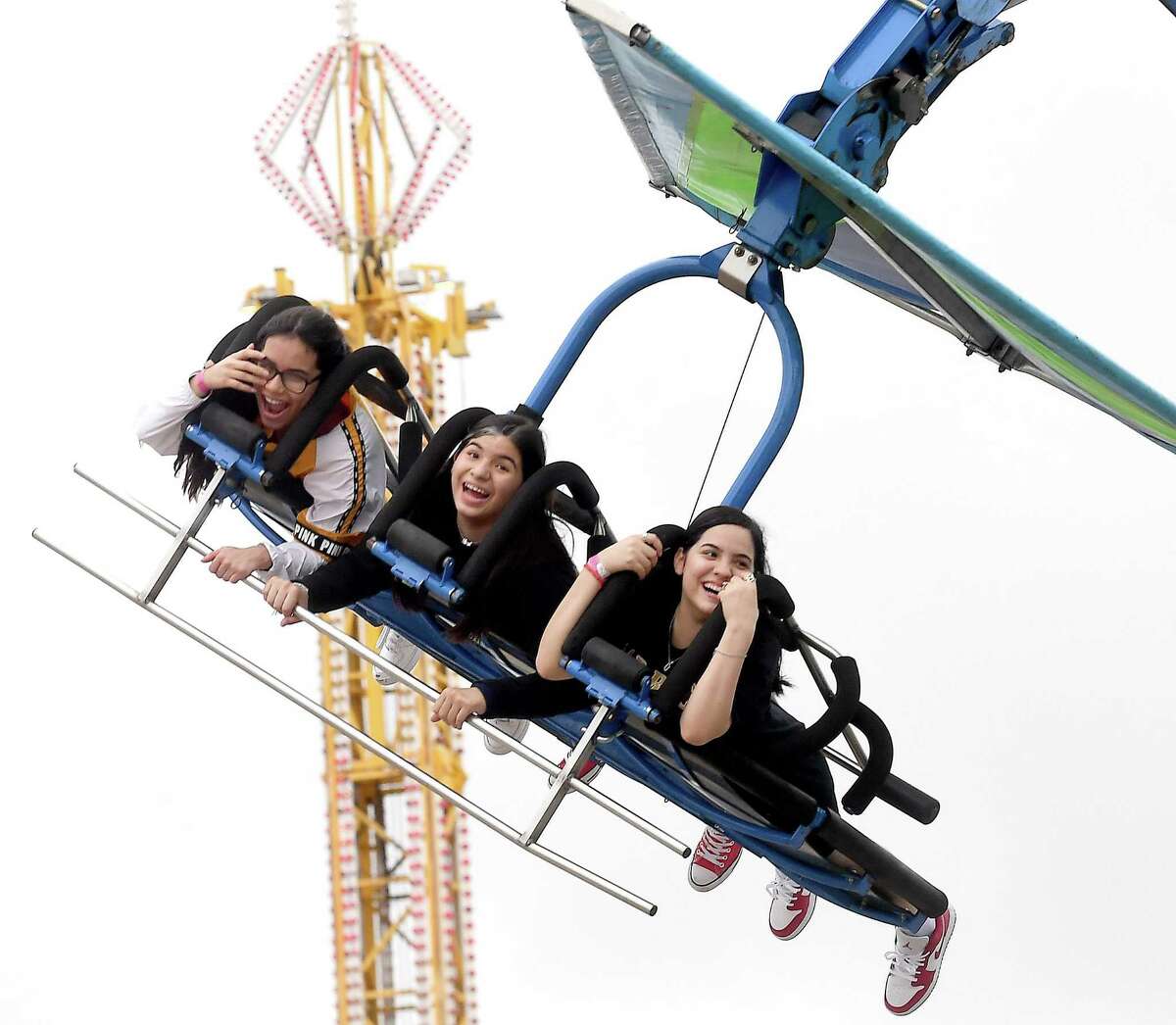 Families and friends enjoy the thrills of the carnival rides on the opening night of the YMBL South Texas State Fair Thursday. Photo made Thursday, May 20, 2021 Kim Brent/The Enterprise