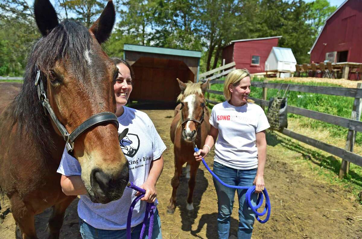 Kristin Song of the Ethan Miller Song Foundation, right, started a horse rescue and equine therapy program, SongStrong Sanctuary of Guilford, run by Mary Santagata, left, founder of the All the King's Horses Equine Rescue of Northford. Ethan Song was the Guilford teen who accidentally shot himself to death in 2018.