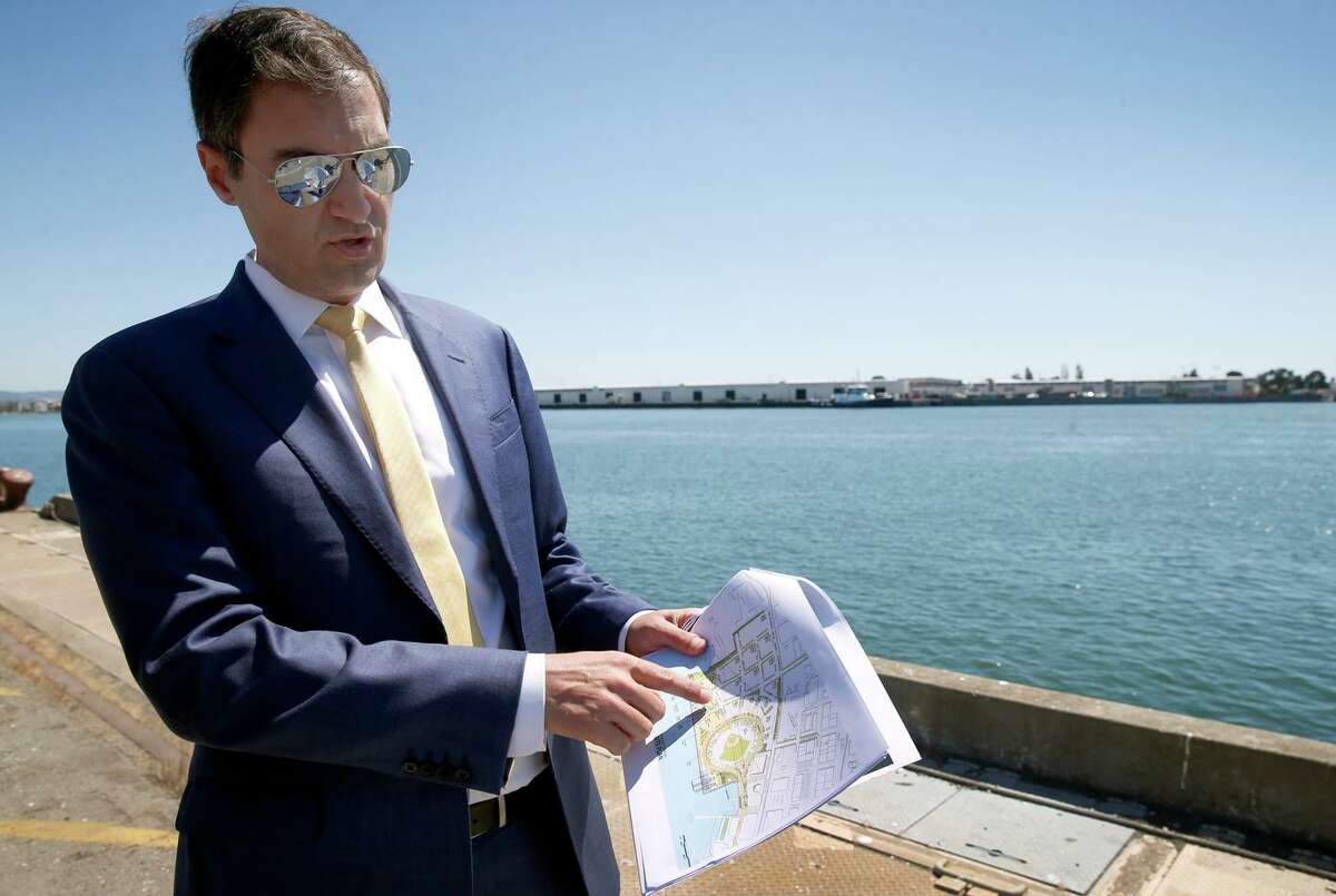 Oakland A's President Dave Kaval describes features of the development plan while leading a private tour of the Howard Terminal site in Oakland, Calif. on Tuesday, Sept. 3, 2019 where the baseball team is hoping to build its new stadium.