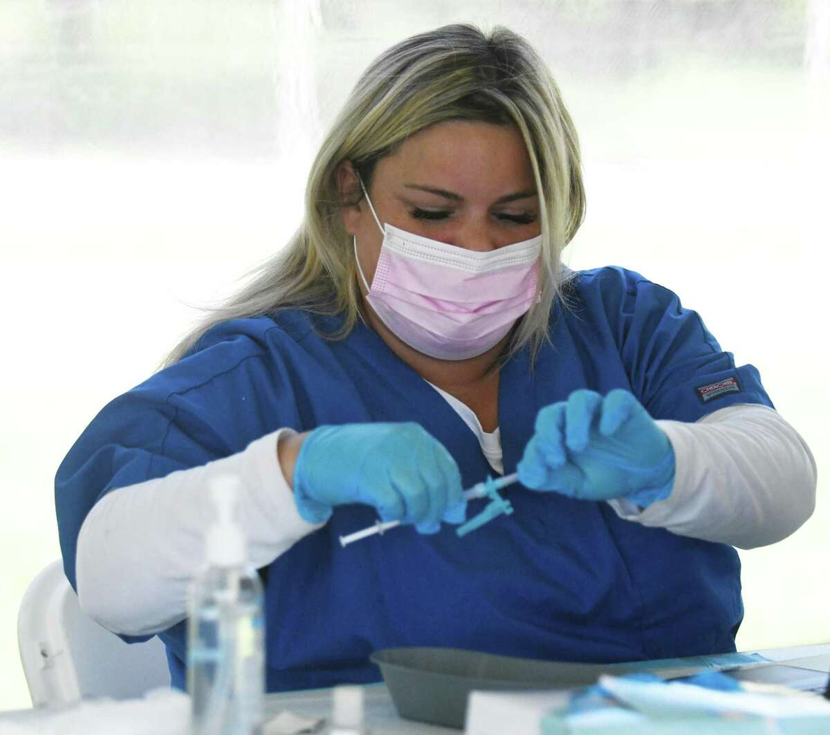 Vaccinator Mary-Kate Lamoult prepares the Pfizer COVID-19 vaccine at the Vaccination Clinic at Boccuzzi Park in Stamford, Conn. Thursday, May 13, 2021. Vaccines are being offered free of charge May 9 through May 15 thanks to a partnership between Griffin Health and the City of Stamford.