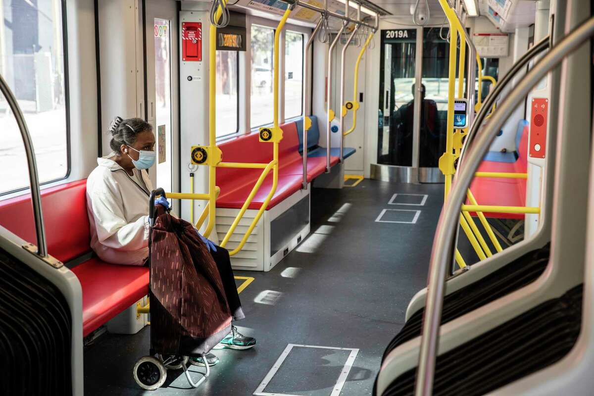A lone passenger sits inside a Muni T-Third Street train as it travels toward Embarcadero Station this month.