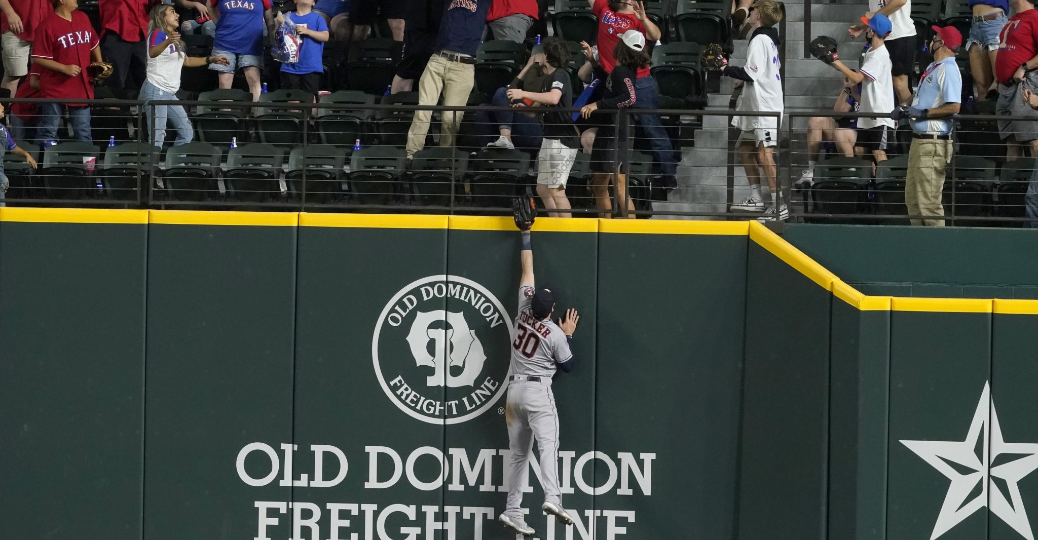 Texas Rangers' Adolis Garcia, left, is greeted by Isiah Kiner-Falefa,  right, after a walk-off single against the Houston Astros in the tenth  inning of a baseball game in Arlington, Texas, Sunday, May