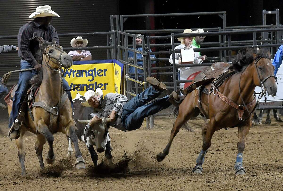 Riders compete in the 75th annual PRCA rodeo on its opening night at the YMBL South Texas State Fair Friday. Photo made Friday, May 21, 2021 Kim Brent/The Enterprise