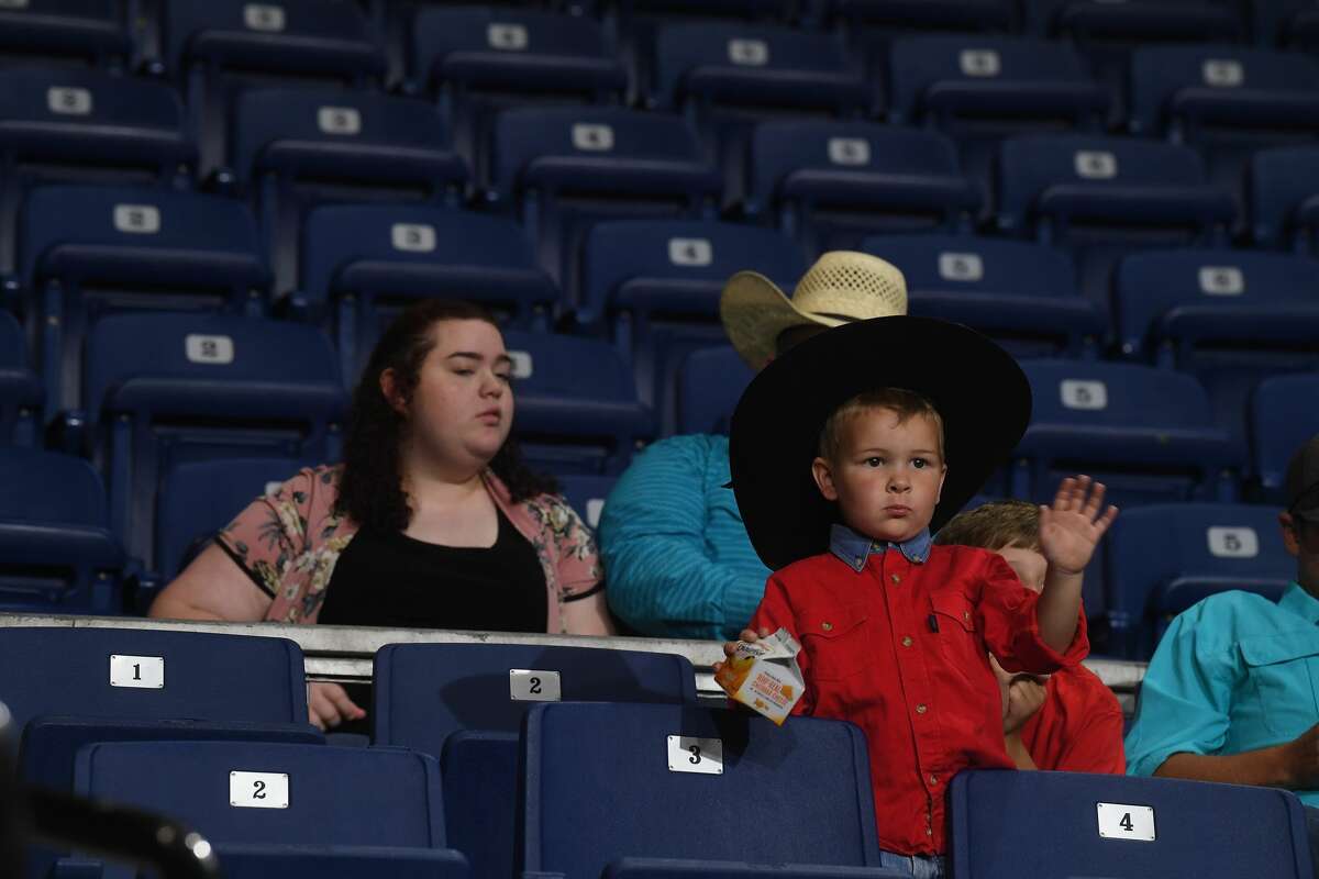 Audience members get ready to watch the 75th annual PRCA rodeo on its opening night at the YMBL South Texas State Fair Friday. Photo made Friday, May 21, 2021 Kim Brent/The Enterprise