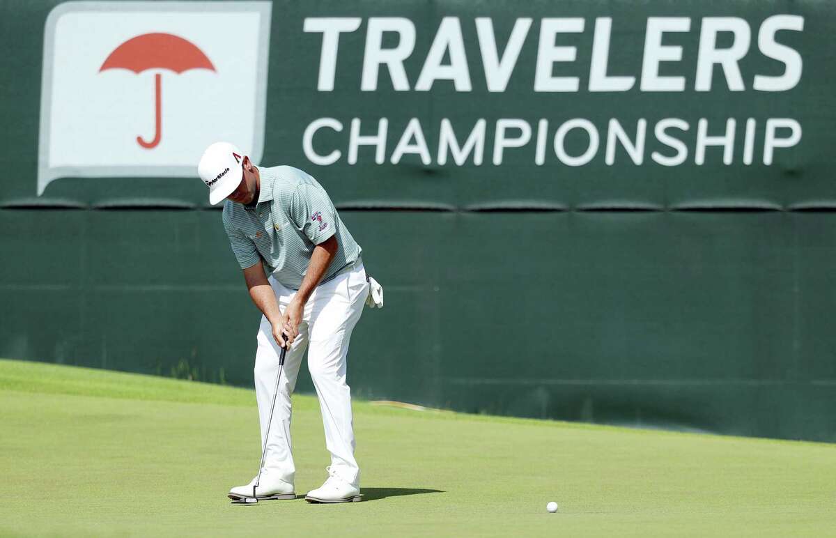 Chez Reavie putts on the ninth green during the final round of the 2019 Travelers Championship.