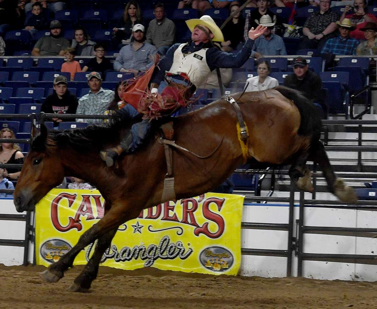 Riders compete in the 75th annual PRCA rodeo on its opening night at the YMBL South Texas State Fair Friday. Photo made Friday, May 21, 2021 Kim Brent/The Enterprise