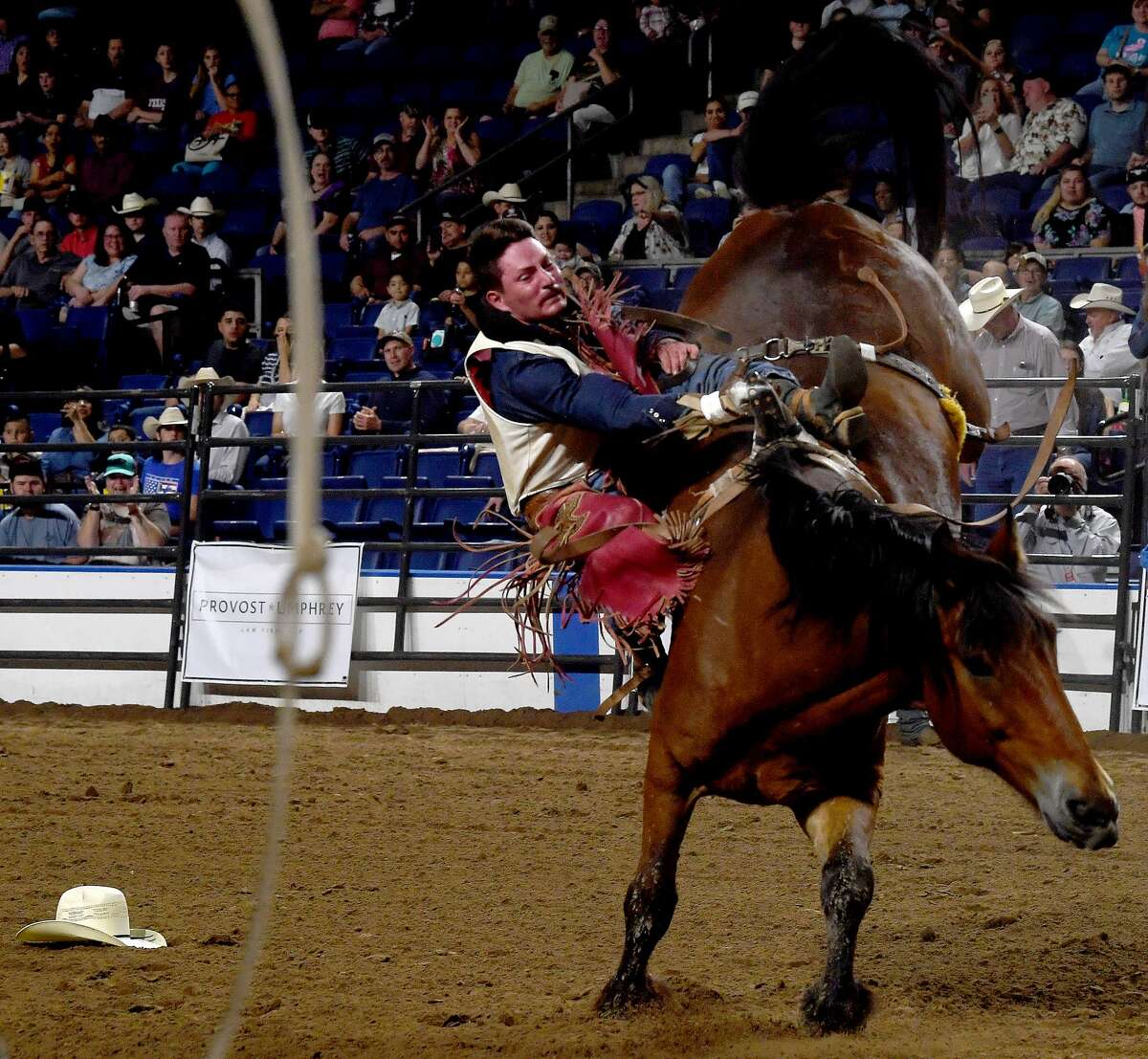 Riders compete in the 75th annual PRCA rodeo on its opening night at the YMBL South Texas State Fair Friday. Photo made Friday, May 21, 2021 Kim Brent/The Enterprise