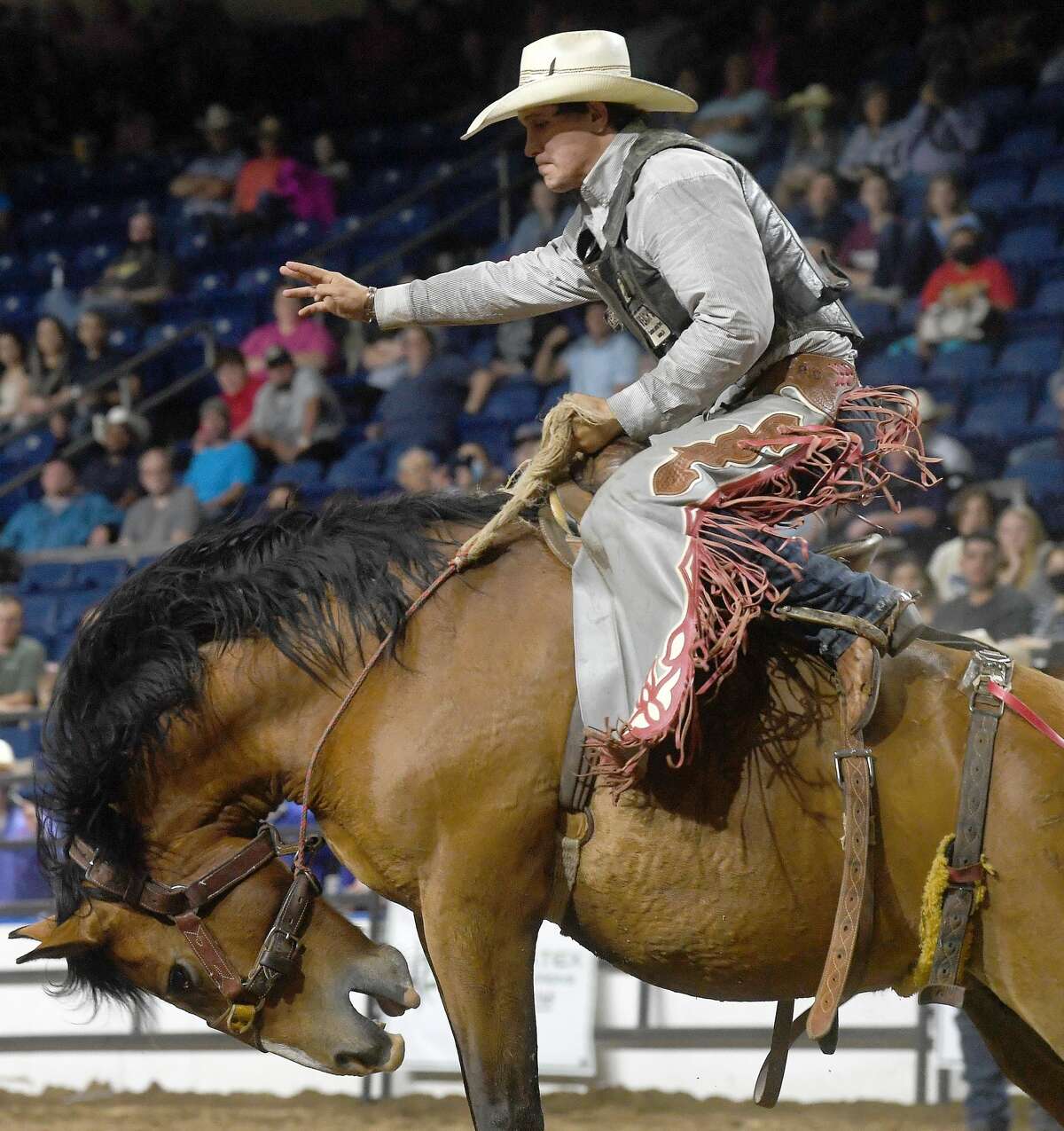Riders compete in the 75th annual PRCA rodeo on its opening night at the YMBL South Texas State Fair Friday. Photo made Friday, May 21, 2021 Kim Brent/The Enterprise