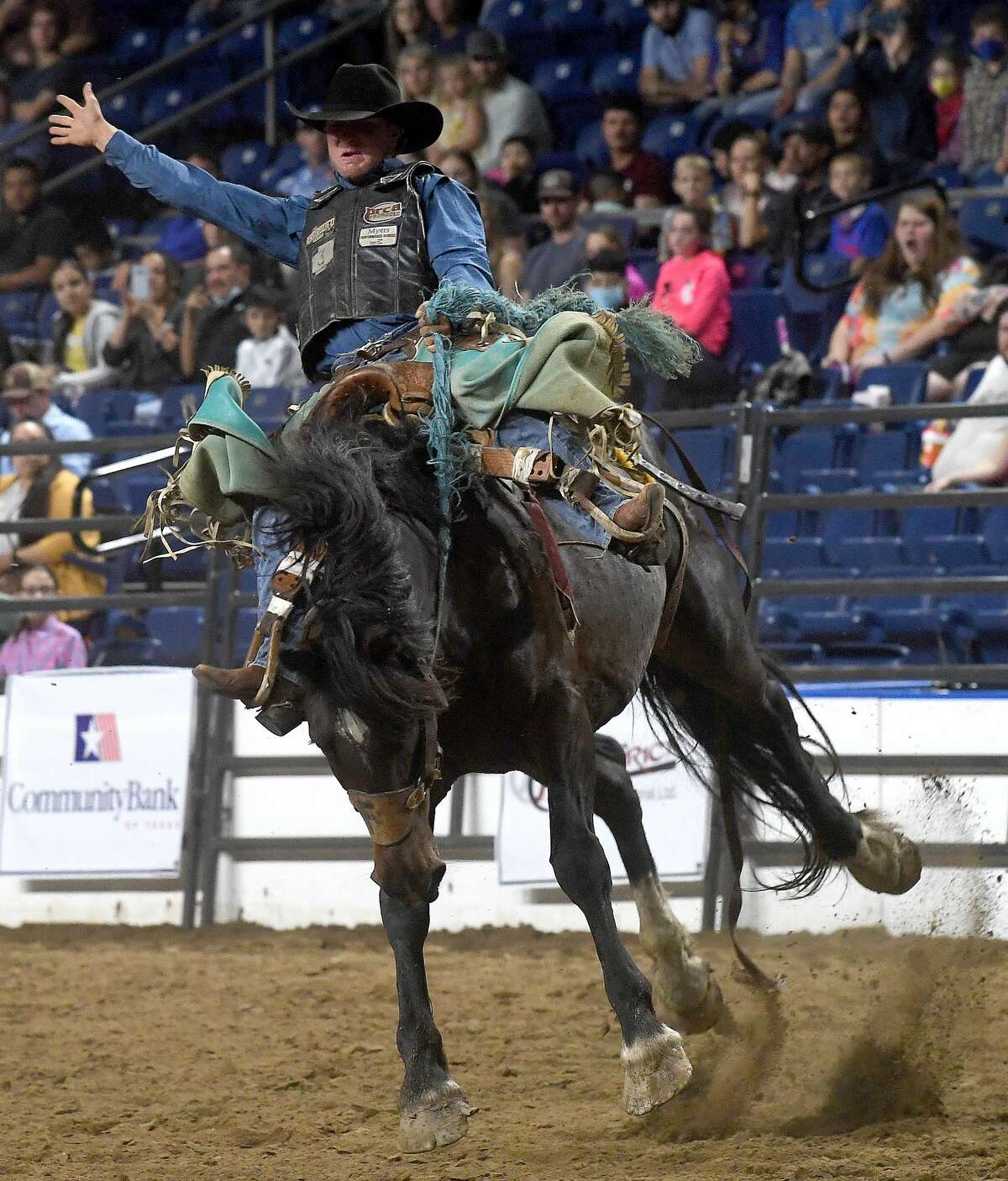 Riders compete in the 75th annual PRCA rodeo on its opening night at the YMBL South Texas State Fair Friday. Photo made Friday, May 21, 2021 Kim Brent/The Enterprise