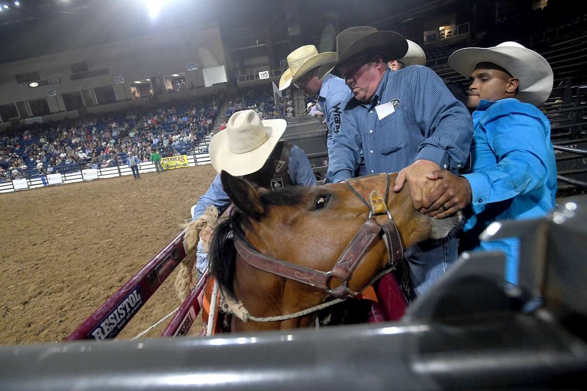 Riders compete in the 75th annual PRCA rodeo on its opening night at the YMBL South Texas State Fair Friday. Photo made Friday, May 21, 2021 Kim Brent/The Enterprise