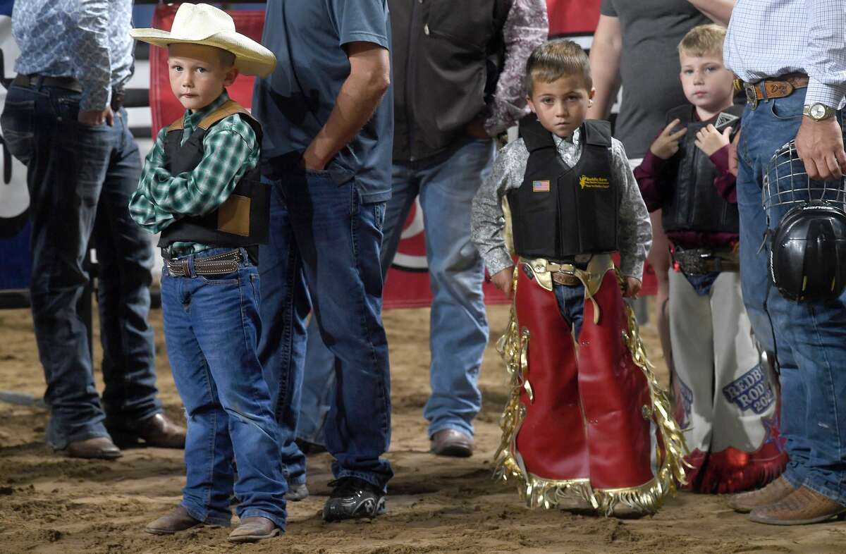 Children compete in the Mutton Bustin' competition during the 75th annual rodeo on its opening night at the YMBL South Texas State Fair Friday. Photo made Friday, May 21, 2021 Kim Brent/The Enterprise