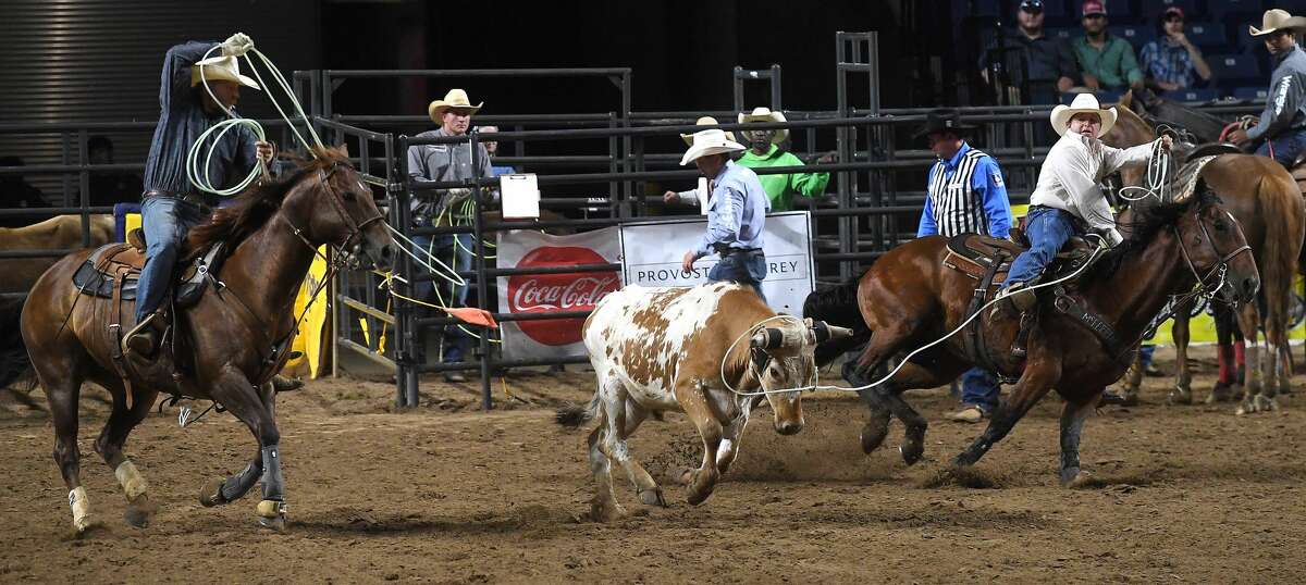 Riders compete in the 75th annual PRCA rodeo on its opening night at the YMBL South Texas State Fair Friday. Photo made Friday, May 21, 2021 Kim Brent/The Enterprise