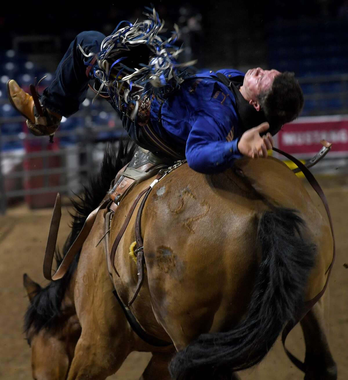 Riders compete in the 75th annual PRCA rodeo on its opening night at the YMBL South Texas State Fair Friday. Photo made Friday, May 21, 2021 Kim Brent/The Enterprise