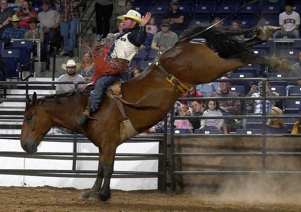 Riders compete in the 75th annual PRCA rodeo on its opening night at the YMBL South Texas State Fair Friday. Photo made Friday, May 21, 2021 Kim Brent/The Enterprise