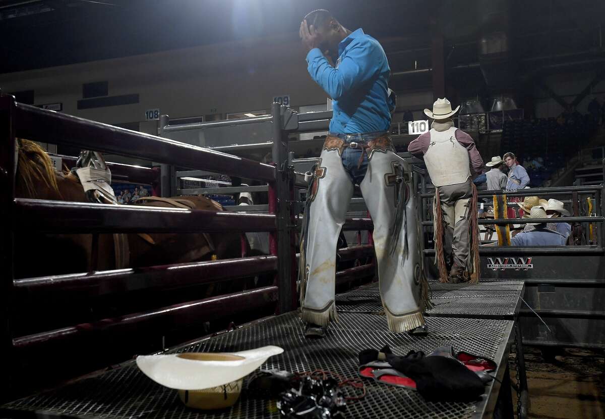 Riders compete in the 75th annual PRCA rodeo on its opening night at the YMBL South Texas State Fair Friday. Photo made Friday, May 21, 2021 Kim Brent/The Enterprise