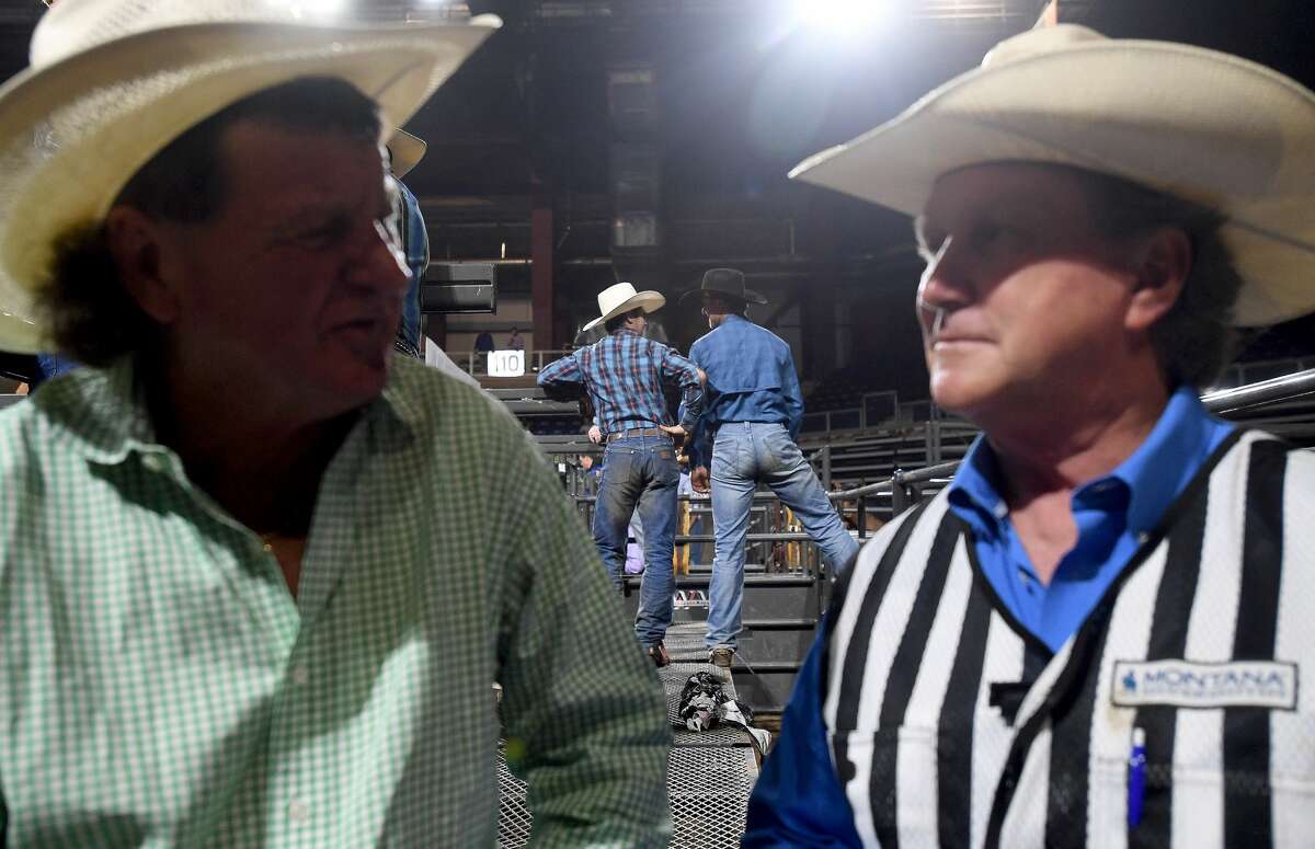 Riders and rodeo staff talk inbetween events during the 75th annual PRCA rodeo on its opening night at the YMBL South Texas State Fair Friday. Photo made Friday, May 21, 2021 Kim Brent/The Enterprise