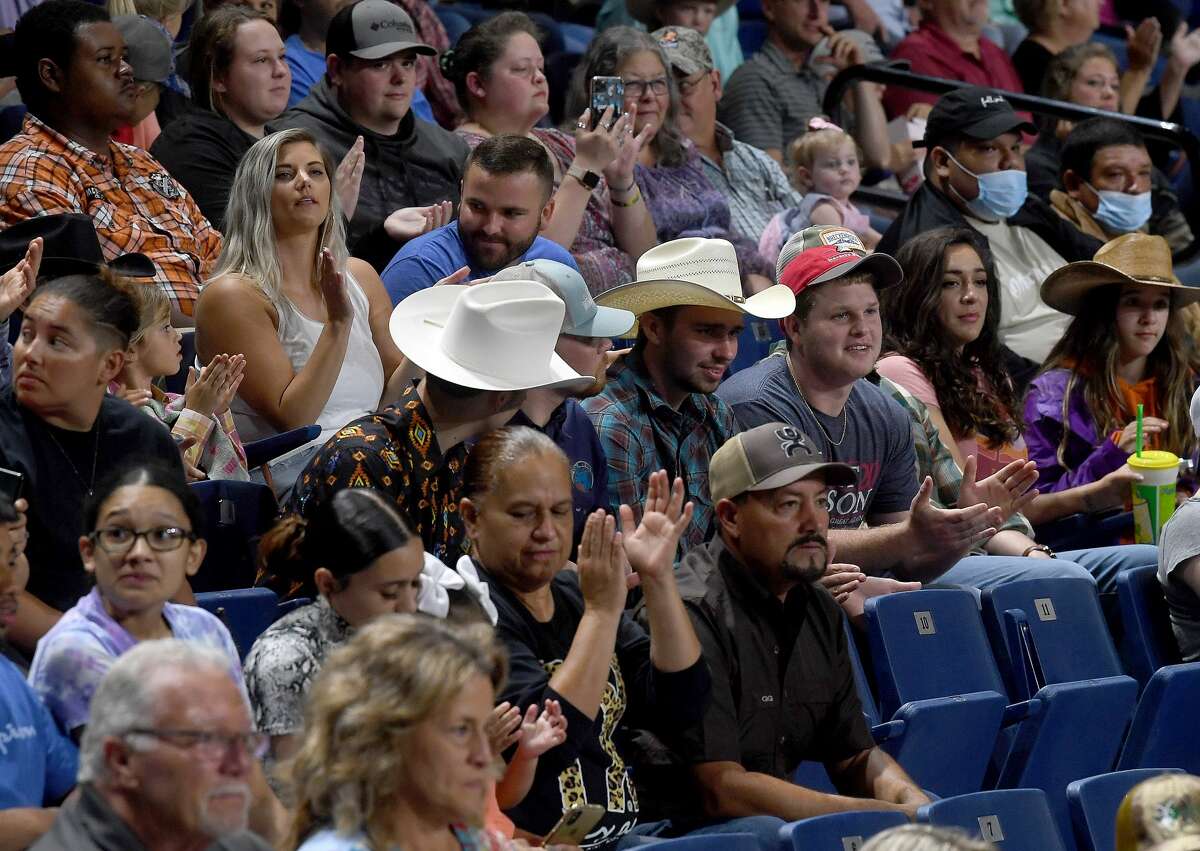 Riders compete in the 75th annual PRCA rodeo on its opening night at the YMBL South Texas State Fair Friday. Photo made Friday, May 21, 2021 Kim Brent/The Enterprise