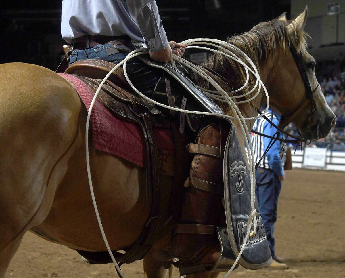 Riders compete in the 75th annual PRCA rodeo on its opening night at the YMBL South Texas State Fair Friday. Photo made Friday, May 21, 2021 Kim Brent/The Enterprise