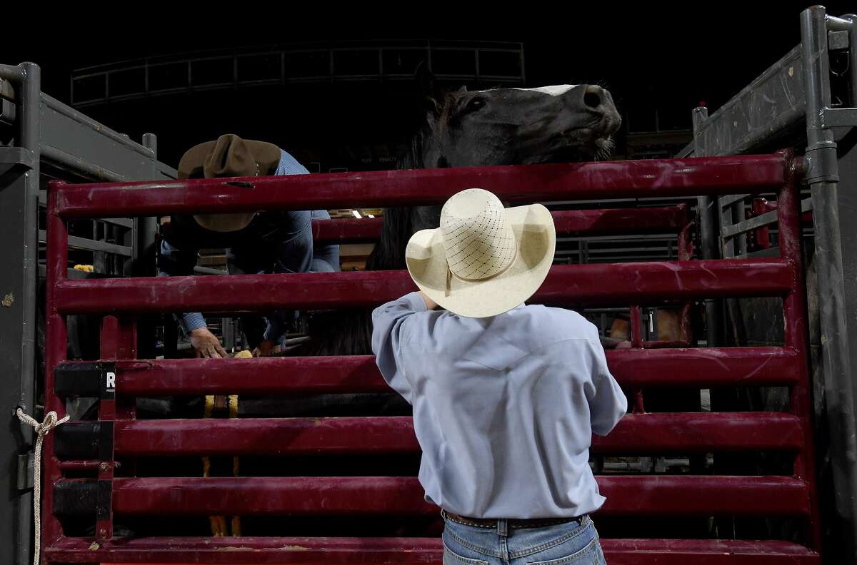 Riders compete in the 75th annual PRCA rodeo on its opening night at the YMBL South Texas State Fair Friday. Photo made Friday, May 21, 2021 Kim Brent/The Enterprise