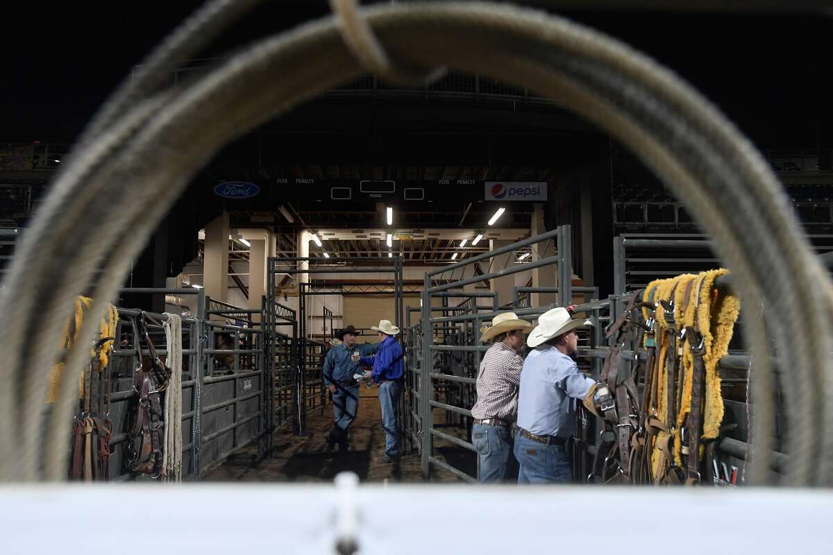 Rodeo staff await the start of the 75th annual PRCA rodeo on its opening night at the YMBL South Texas State Fair Friday. Photo made Friday, May 21, 2021 Kim Brent/The Enterprise