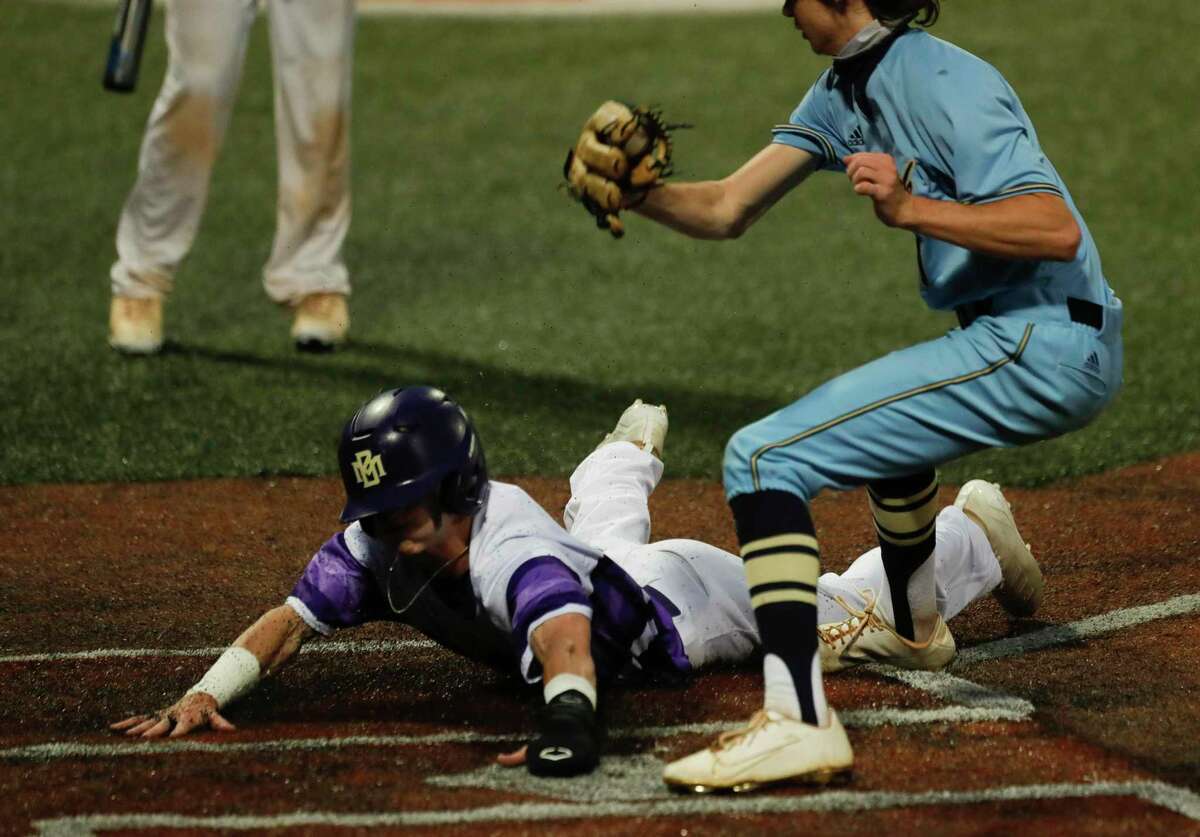 Trey Acreman #2 of Montgomery scores on wild pitch by Lake Creek starting pitcher Shane Sdao in the first inning of Game 2 of a high school baseball Region II-6A quarterfinal series at Sam Houston State University, Friday, May 21, 2021, in Huntsville.