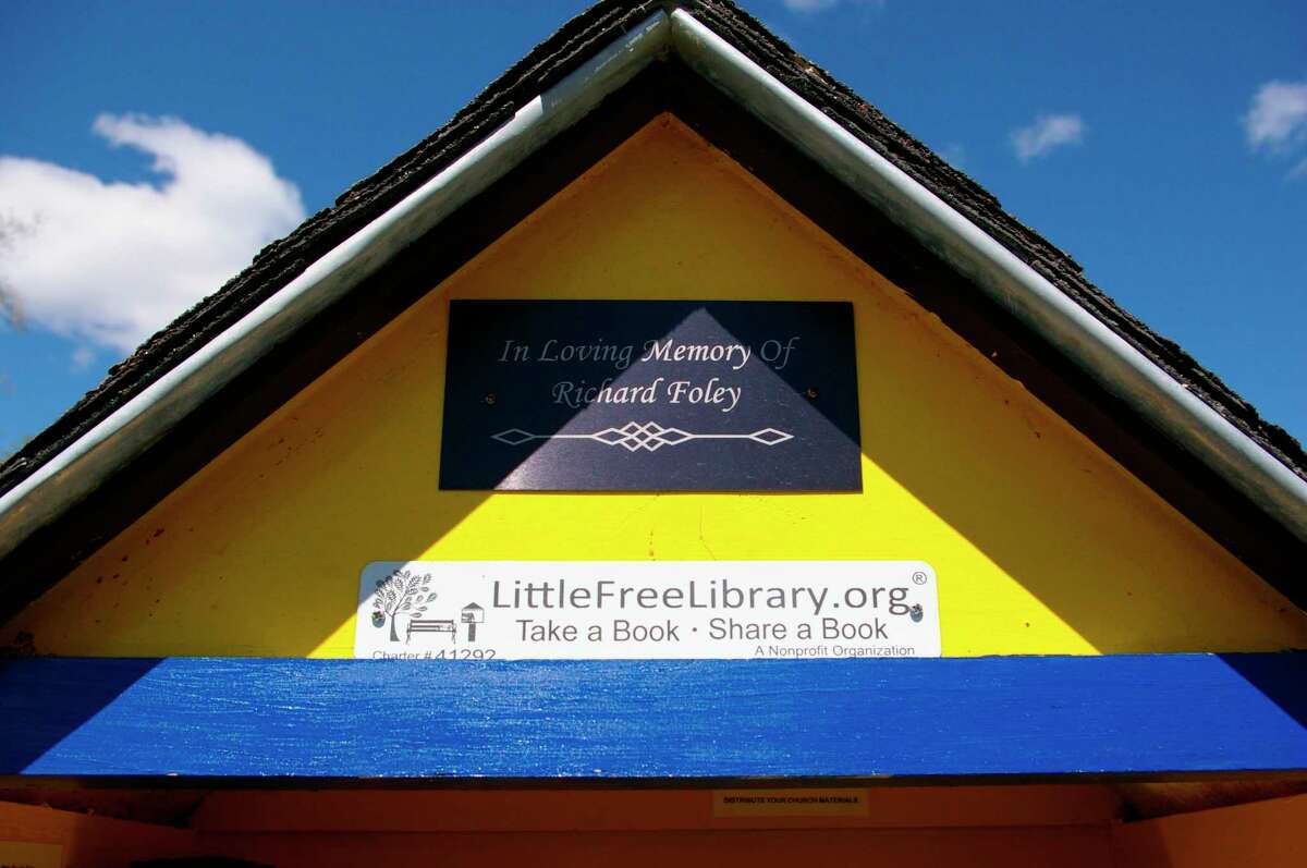 The Little Free Library in Sanford is dedicated to the late Richard Foley, who helped his wife, Cassie Foley, maintain the library for several years. (Photo by Niky House)  