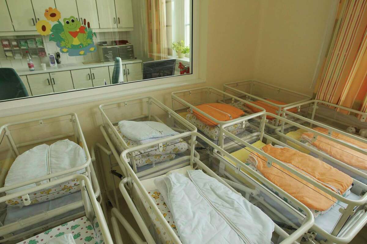 Empty baby beds stand in the maternity ward of a hospital. (Photo by Sean Gallup/Getty Images)