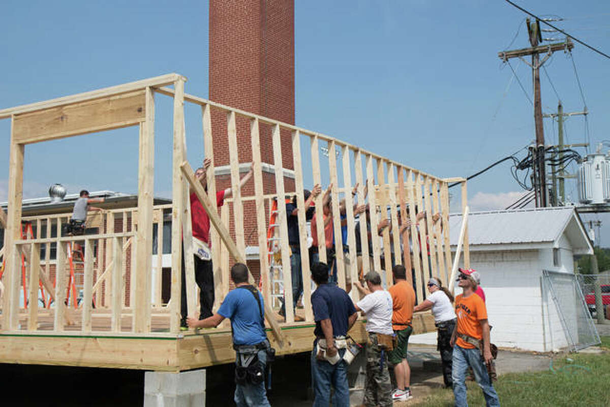Volunteers help construct a Habitat For Humanity home. The Edwardsville/Glen Carbon chapter of Habitat For Humanity will host home ownership orientations to find a prospective area family to inhabit their own home.