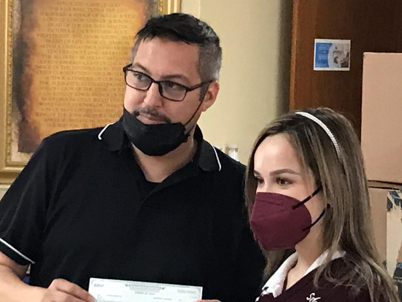 Scholarship recipient donates check to Holding Institute - Vimarsana News