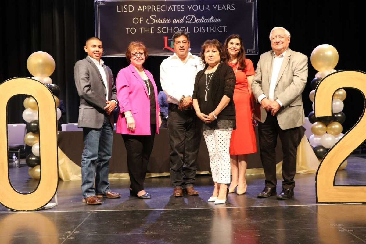 Belinda Casarez, LISD child nutrition program secretary, is thanked by LISD Board of Trustees member and Superintendent of Schools Dr. Sylvia G. Rios for her 48 years of service to school district. Pictured from left are LISD Board Member Guadalupe Gomez, Rios, LISD Board President Hector “Tito” Garcia, Casarez, LISD Board Parliamentarian Dr. Minita Ramirez and Board Member Hector Noyola.