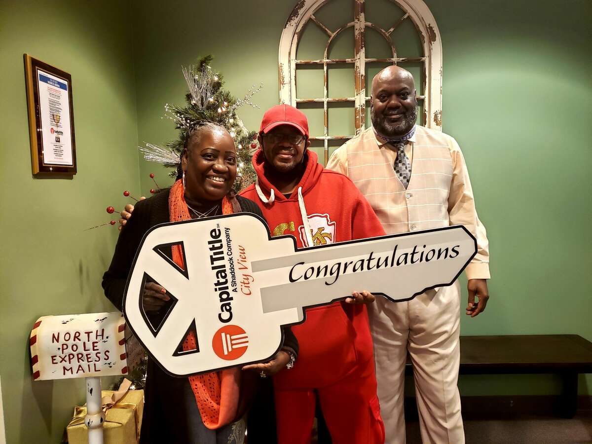 San Antonio residents Veda (from left) and David Reddic closed on their home on New Year's Eve. Their REALTOR, Mike Franklin, introduced the couple to a lender who advised them on how to quickly resolve their credit issues.