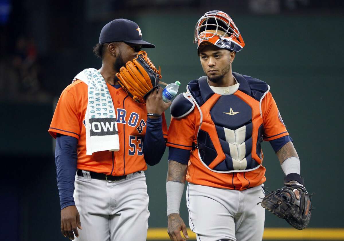 Texas Rangers' Adolis Garcia, left, is greeted by Isiah Kiner-Falefa,  right, after a walk-off single against the Houston Astros in the tenth  inning of a baseball game in Arlington, Texas, Sunday, May