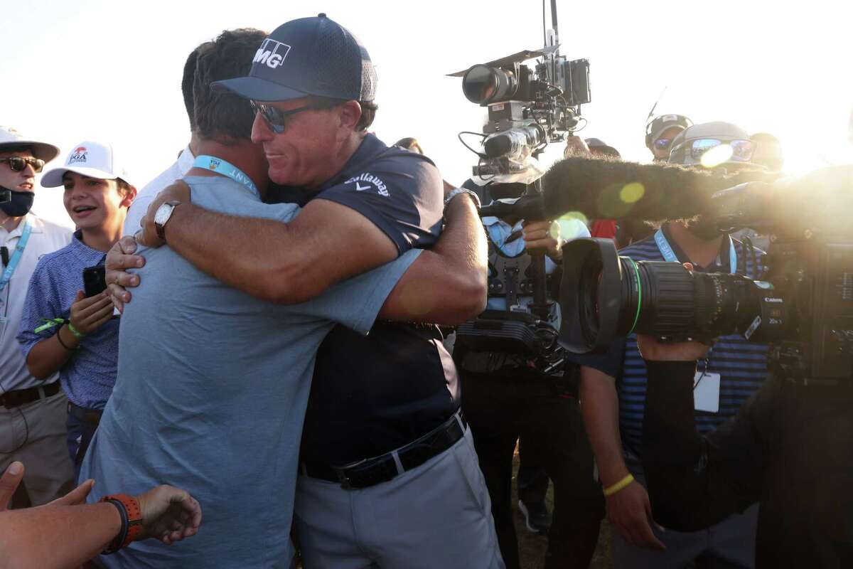 KIAWAH ISLAND, SOUTH CAROLINA - MAY 23: Phil Mickelson of the United States celebrates with Jon Rahm of Spain after winning on the 18th green during the final round of the 2021 PGA Championship held at the Ocean Course of Kiawah Island Golf Resort on May 23, 2021 in Kiawah Island, South Carolina.