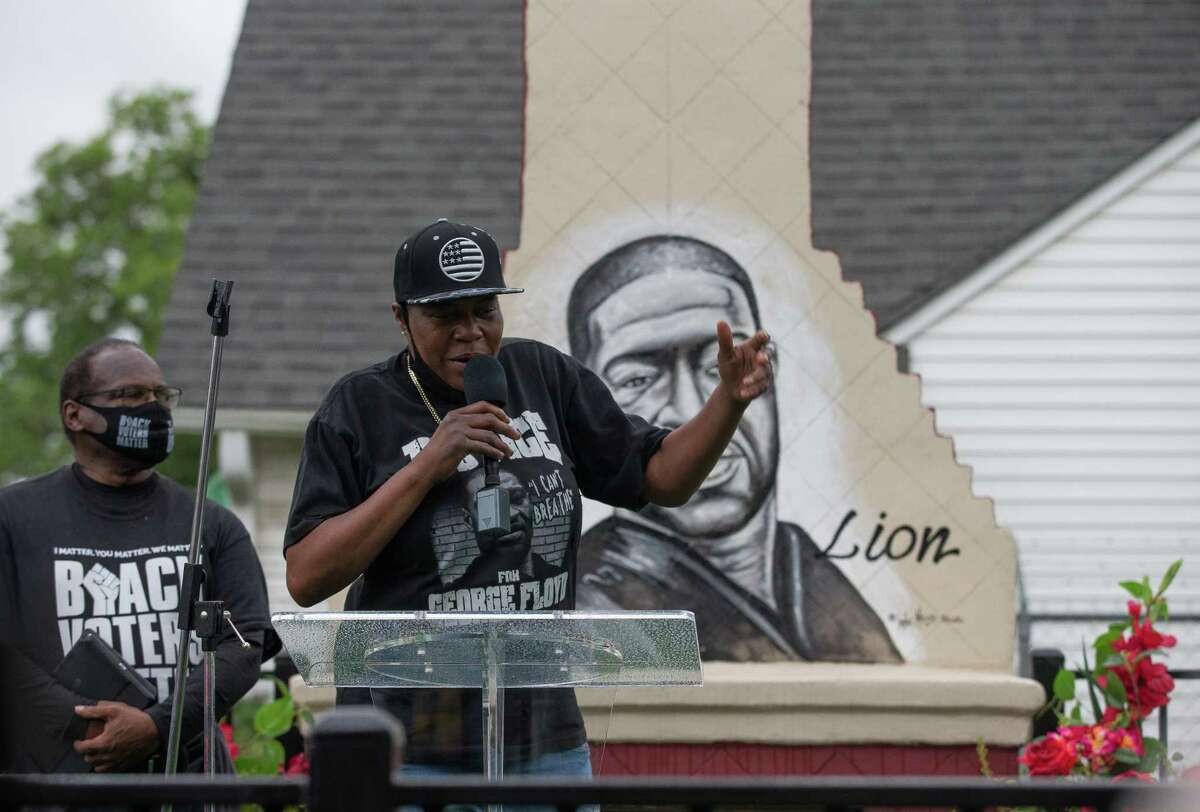 LaTonya Floyd — sister of George Floyd — talks to a crowd of people attending the dedication George Floyd Park at Alabama and Napoleon streets on Sunday, May 23, 2021, in Houston. George Floyd was killed by Minneapolis Police officer Derek Chauvin on May 25, 2020.