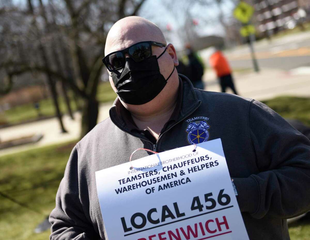 Business agent Roger Taranto protests with Teamsters Local 456 Greenwich town employees outside Town Hall in Greenwich, Conn. Monday, March 22, 2021. Town essential employees state that they have been working to keep Greenwich running throughout the pandemic but its members have been without a contract for more than two years.
