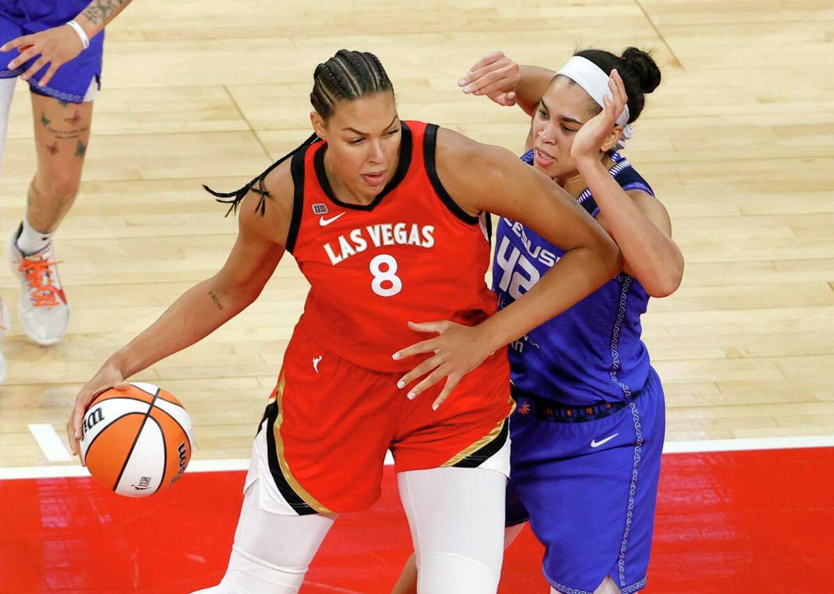 LAS VEGAS, NEVADA - MAY 23: Liz Cambage #8 of the Las Vegas Aces is guarded by Brionna Jones #42 of the Connecticut Sun during their game at Michelob ULTRA Arena on May 23, 2021 in Las Vegas, Nevada. The Sun defeated the Aces 72-65. NOTE TO USER: User expressly acknowledges and agrees that, by downloading and or using this photograph, User is consenting to the terms and conditions of the Getty Images License Agreement. (Photo by Ethan Miller/Getty Images)