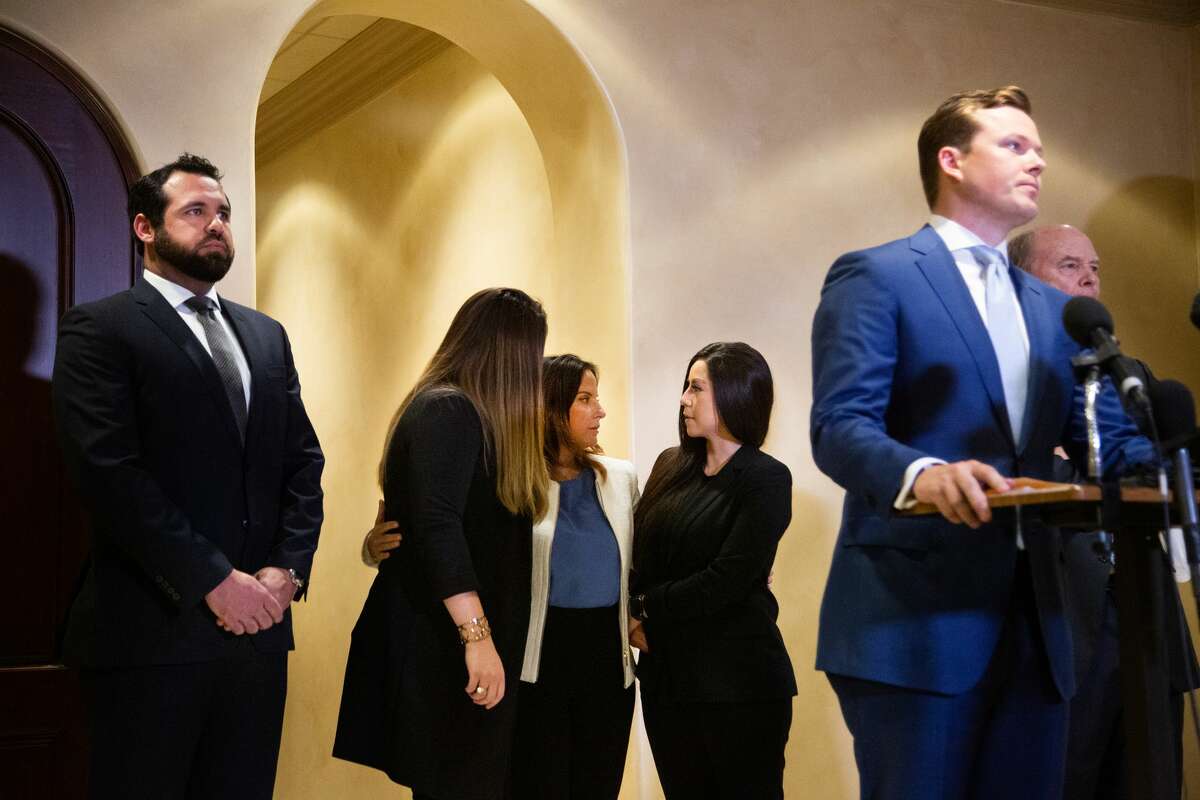 Jacquelyn Aluotto, center, talks to other plaintiffs after speaking to members of the press at a press conference about alleged sexual misconduct against female deputies in the Harris County Constable Precinct 1, Monday, May 24, 2021, in Houston.