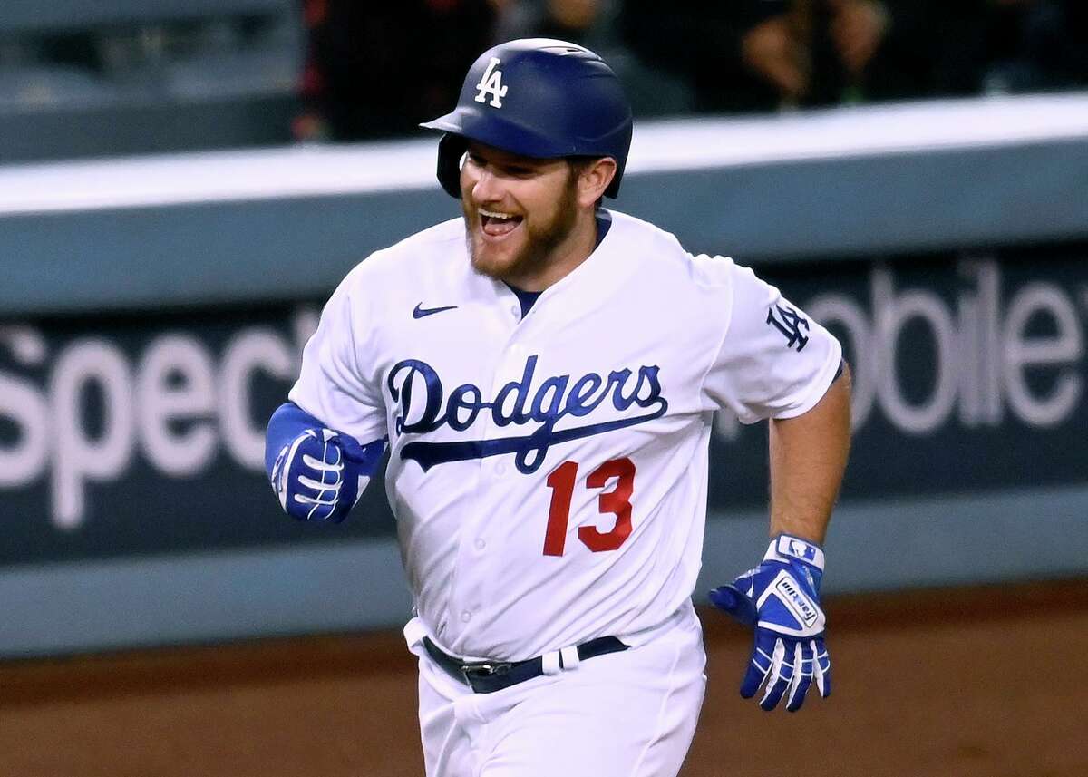 Los Angeles Dodgers' infielder Max Muncy celebrates with teammate