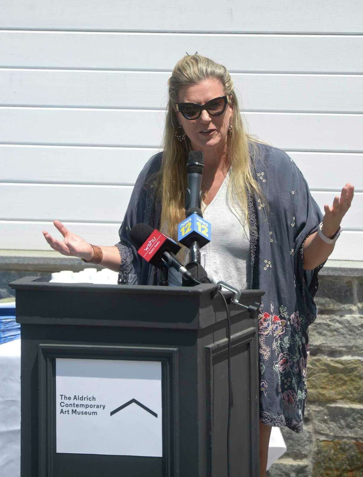 Ridgefield Playhouse Executive Director Allison Stockel speaks at The Aldrich Contemporary Art Museum in Ridgefield. Gov. Ned Lamont was there to recognize the town’s approval for the state’s first designated cultural district.