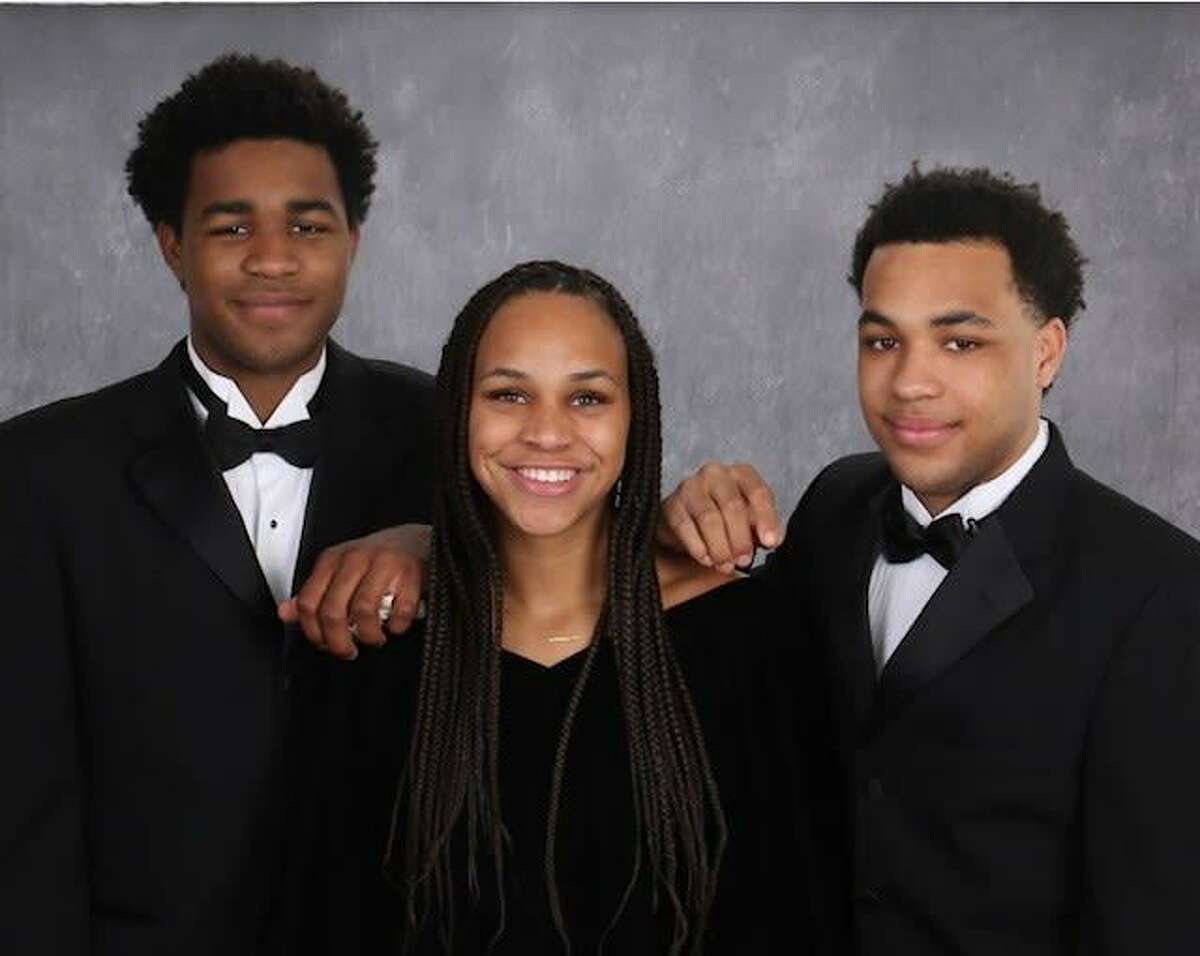 The Elie triplets (left to right: Gaston, Lauren, Glenn) were among three sets of triplets and 18 sets of twins to graduate on May 21 as part of the Memorial High School class of 2021