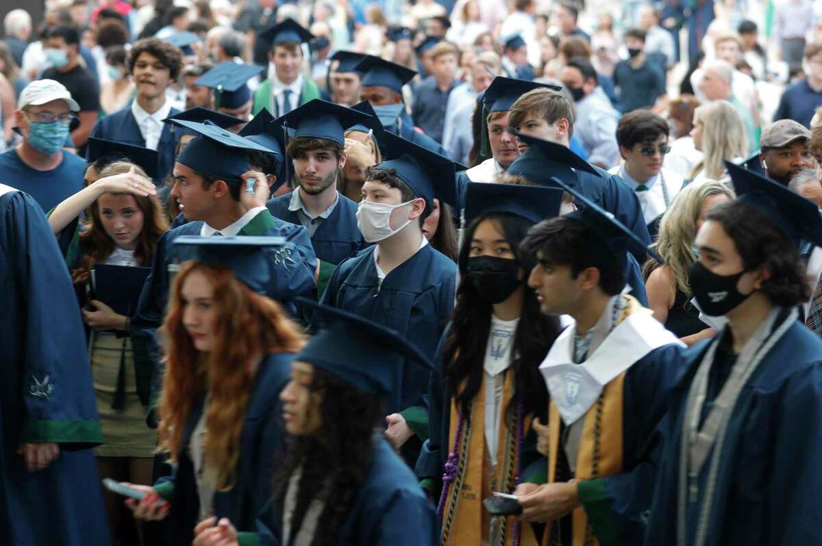 College Park students file into the Cynthia Woods Mitchell Pavilion for a graduation ceremony, Monday, May 24, 2021, in The Woodlands.